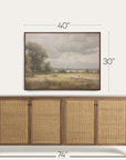 wooden sideboard with wicker doors and framed landscape painting above, with dimensions indicated.