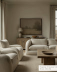 living room with beige sofa, armchairs, and wooden coffee table.