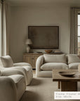 living room with beige sofa, armchairs, and wooden coffee table.