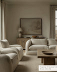 living room with beige sofa, armchairs, and wooden coffee table.