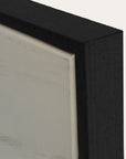 close-up of a black picture frame corner with a white background