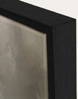 close-up of a textured wall art piece with a black frame.
