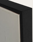 close-up of a black frame corner with a light gray background