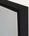 close-up of a black frame corner with a white background