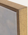 close-up of a wooden frame corner with a neutral background