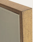 close-up of a wooden frame corner on a neutral background