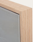 close-up of a wooden frame corner with a gray background