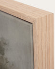 close-up of a wooden picture frame with a textured gray background