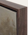 close-up of a wooden frame corner with a textured surface.