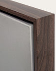 close-up of a wooden picture frame corner with a neutral background