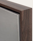 close-up of a wooden picture frame corner with a neutral background
