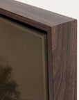 close-up of a wooden picture frame corner with a blurred painting inside.