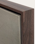 close-up of a wooden frame corner with a textured gray surface.