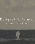 person walking along a coastal path with 'designed & painted by madelynn ave' text overlay.