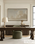 modern office interior with a wooden desk, chair, and framed artwork on the wall.
