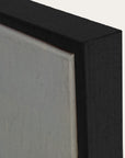 close-up of a black frame corner with a gray background