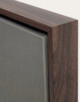 close-up of a wooden frame corner on a gray background