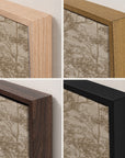 four close-up views of framed wall art showing different wood frame finishes: light natural wood, medium warm wood, dark brown wood, and matte black. the artwork behind the frames has a beige toile-style botanical pattern.