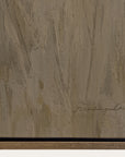 textured brown surface with a signature at the bottom