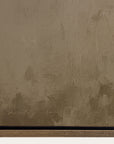 textured brown surface with a signature at the bottom