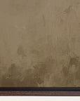 textured brown wall with a signature at the bottom