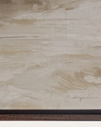 close-up of a textured beige surface with a signature at the bottom right corner.