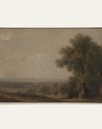 a framed landscape painting featuring a large tree on the right side of a wide, muted valley under a cloudy sky, shown against a plain light background.