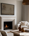 living room with fireplace, white armchair, and coffee table with decorative items.