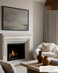 living room with fireplace, white armchair, and coffee table with decor items.