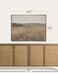 wooden sideboard with wicker doors and a framed landscape print above it, with dimensions displayed.