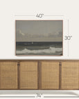 wooden sideboard with wicker doors and framed artwork above on a white background