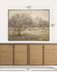 framed landscape painting above a wooden sideboard with dimensions indicated.