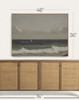 wicker sideboard with framed artwork above it, showing dimensions.
