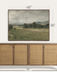 framed landscape painting above a wooden sideboard with dimensions indicated.