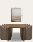 wooden table with four gray chairs and a framed landscape picture on a white background