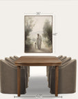 dining room setup with a wooden table and gray chairs, featuring a framed artwork above.