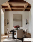 dining room with wooden coffered ceiling, table, chairs, and a large mirror.