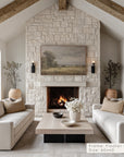 living room with stone fireplace, white sofas, and a painting above the fireplace. __lifestyleimage