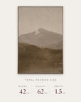 white mountains in a gold floater frame with its total framed size listed below: 42 inches wide, 62 inches high, and 1.5 inches deep.