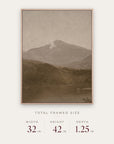 white mountains in a light oak floater frame with its total framed size listed below: 32 inches wide, 42 inches high, and 1.25 inches deep.