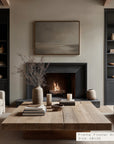 living room with a fireplace, wooden coffee table, and shelves with decor items.