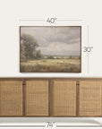 wooden sideboard with wicker doors and a framed landscape painting above it, with dimensions indicated. 