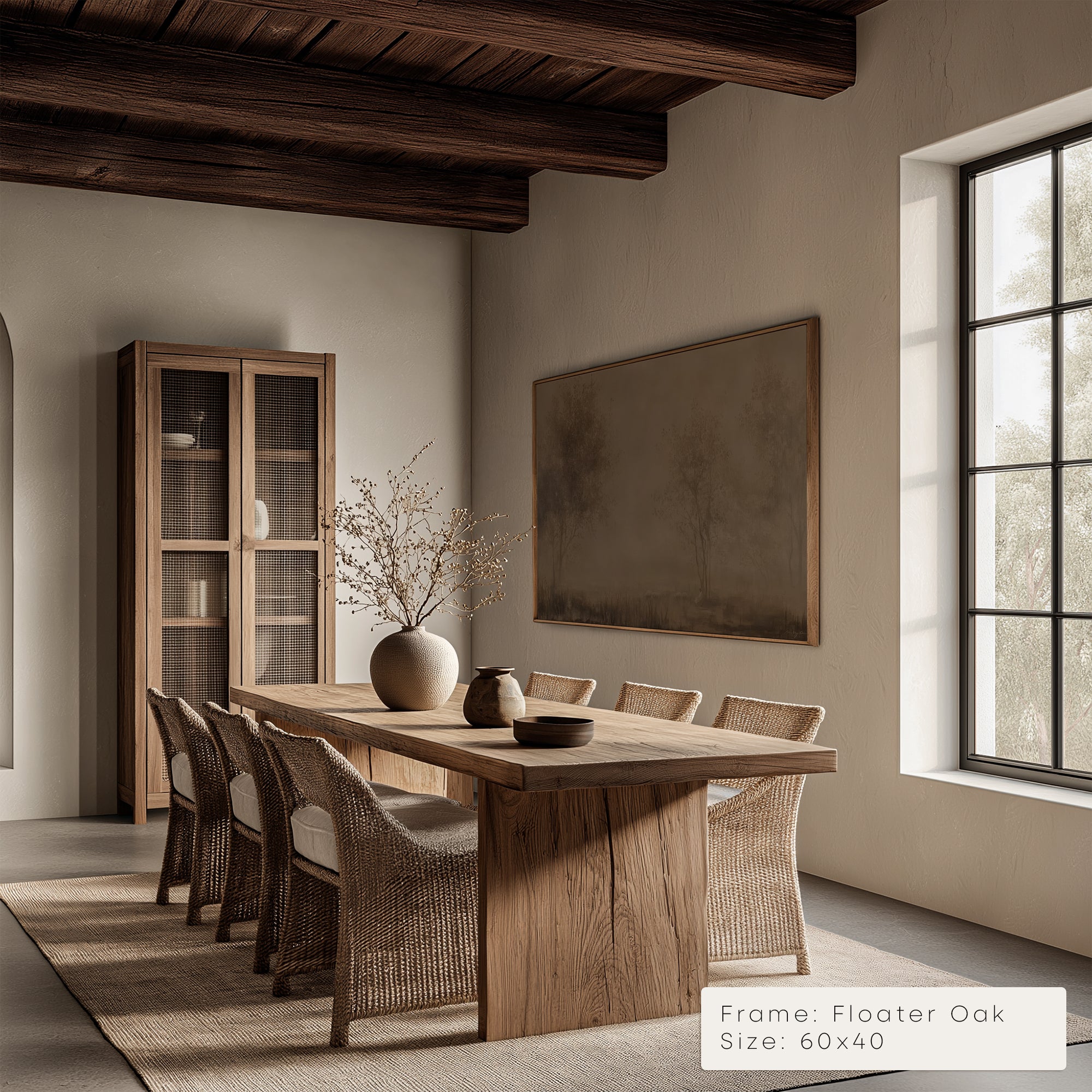 Dining room with wooden table and chairs, framed artwork on the wall.