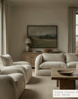 living room with beige sofa, armchairs, and wooden coffee table. __lifestyleimage