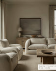 modern living room with beige sofa, armchairs, and wooden coffee table.