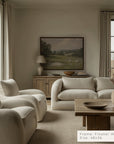 living room with beige sofa, armchairs, and a wooden coffee table.