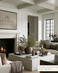living room with fireplace, sofa, and decorative items.