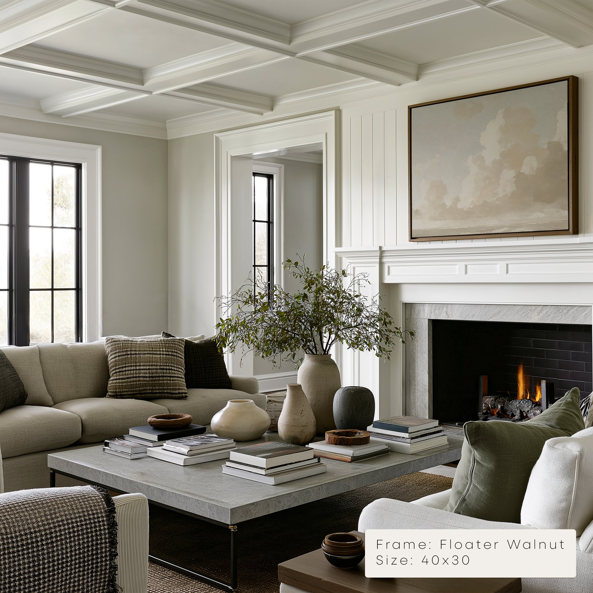 Living room with a fireplace, sofa, coffee table, and decorative items. 