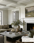 living room with fireplace, sofa, coffee table, and decorative items. __lifestyleimage