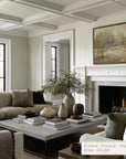living room with a fireplace, couch, coffee table, and decorative items.